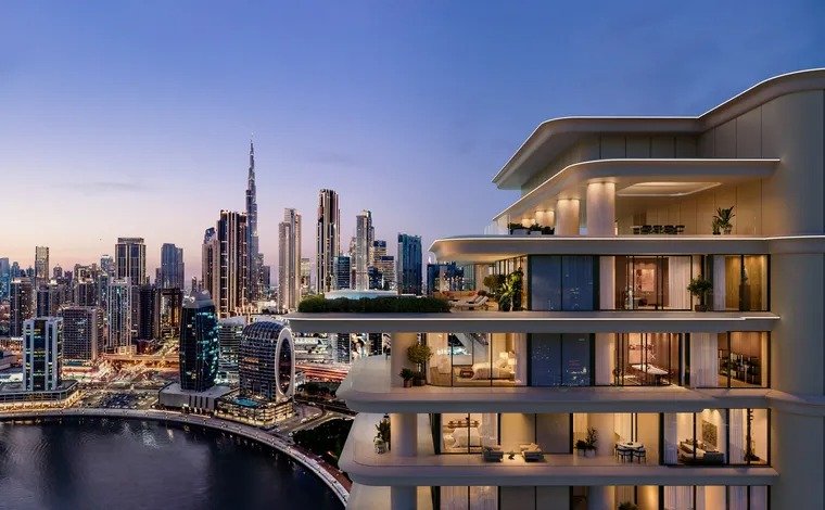 Residence balcony overlooking calm water and sailboats at sunset